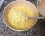 A picture of step 3 of Super Cheesy Scrambled Eggs.
