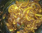 A picture of step 3 of Alkubus with onion sauce.