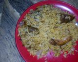 A picture of step 3 of Jollof rice wt pomo n slice onion.