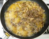 A picture of step 5 of Beef and Tofu Sukiyaki-Style with Napa Cabbage and Scallions.