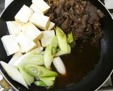 A picture of step 8 of Beef and Tofu Sukiyaki-Style with Napa Cabbage and Scallions.