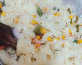 A picture of step 4 of Italian white sauce pasta.