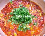 A picture of step 5 of Shakshuka with Eggs and Pastrami.
