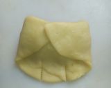 A picture of step 13 of Bow tie buns.