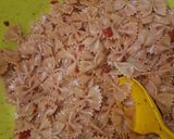A picture of step 2 of Stuffed chicken with macaroni and onion rings.