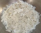 A picture of step 1 of Aloo Matar Chatpata Poha (Flattened rice with peas and potatoes).
