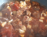 Foto del paso 7 de la receta: Caldereta de cordero con vino tinto, huevo duro y almendras