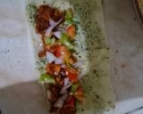 A picture of step 17 of Tandoori chicken rolls up.