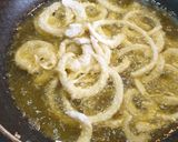 A picture of step 4 of Fried European Sole on a Bed of Potatoes and Garlic with Onion Rings.