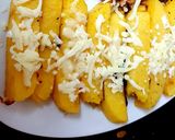A picture of step 3 of Polenta Chips with mozarella cheese & Italian herbs.
