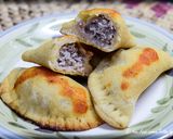 A picture of step 6 of Mini Calzones with Sausage and Cheese Filling.