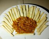 A picture of step 2 of Fried yam with carrot sauce.
