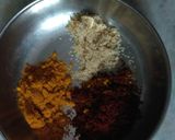 A picture of step 3 of Palak panch dal khichdi tempered with burnt garlic.