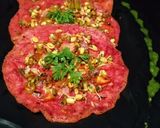 A picture of step 7 of Oats chila with sprouted beans topping.