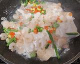 A picture of step 3 of My Saffron tumeric Rice with cod, prawns and veg.