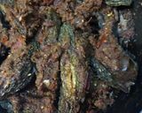 A picture of step 9 of Bharwa karele (bitter gourd).