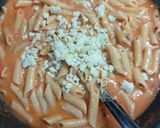 A picture of step 5 of Pink cheese pasta with garlic bread.