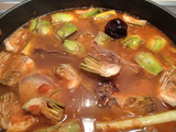 Arroz meloso con alcachofas y conserva de cerdo