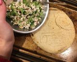 A picture of step 6 of Greek inspired Pita Pizza.