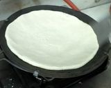 A picture of step 2 of White sorghum chapati on clay tawa.