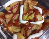 A picture of step 4 of Loaded Pizza fries.