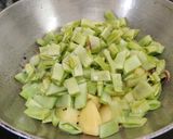 A picture of step 4 of Sem Aloo with Kalonji Seeds.