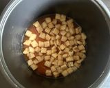 A picture of step 2 of Abura-age (Fried Thin Tofu) & Cabbage Takikomigohan.