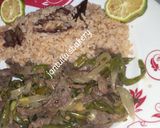 A picture of step 9 of Kilishi rice and green shredded beef.