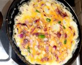 A picture of step 3 of Paratha with egg omelette.