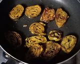 A picture of step 5 of Homemade crispy Patra with some spicy green chutney.