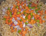 A picture of step 6 of Jollof macaroni with fried boneless fish.