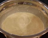 A picture of step 12 of Vanilla Layer Cake with Whipped White Chocolate Filling and Fros.