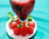 A picture of step 2 of Watermelon Mojito with blue Curacao.