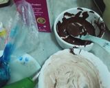 A picture of step 7 of Vanilla cream cake with chocolate chips inside.