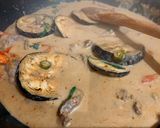 A picture of step 8 of Beef and grilled aubergine red curry topped with Bird eye chillis.