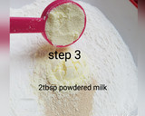 A picture of step 3 of Bow tie buns.