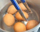 A picture of step 3 of 6 minute jammy soy-marinated eggs.