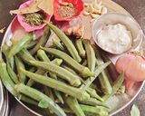 A picture of step 1 of Masaledar dahi (curd) bhindi.