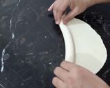 A picture of step 3 of Rope Style Paratha Folding.