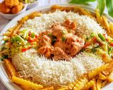 A picture of step 8 of Saucy Crispy chicken with rice fries and vegetable.