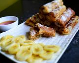 A picture of step 15 of Peanut Butter French Toast Roll-Ups With Banana & Almond Filling.