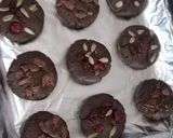 A picture of step 4 of Dark Chocolate cookies with Chocochips and berries on top.
