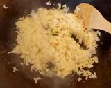 A picture of step 2 of My Egg fried Rice with the malaysian curry sauce.