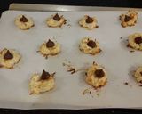 A picture of step 7 of Coconut Macaroon s with a Chocolate Center.