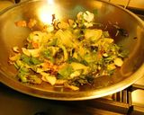 A picture of step 3 of A novel recipe- ravioli/samosa  made with rice paper stuffed with veggies.