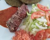 Foto del paso 4 de la receta: Rollo de milanesa, con jamón y queso