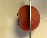 A picture of step 1 of How to Cut Tomatoes Without Crushing the Seeds.