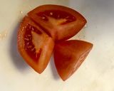 A picture of step 3 of How to Cut Tomatoes Without Crushing the Seeds.