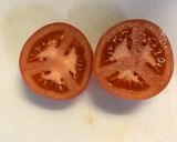 A picture of step 2 of How to Cut Tomatoes Without Crushing the Seeds.