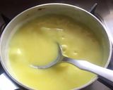 A picture of step 4 of Kesari Rasmalai topping with crunchy nuts.